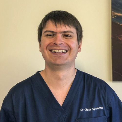 Jane Williams Head and shoulders photo of Dr Chris Symmons